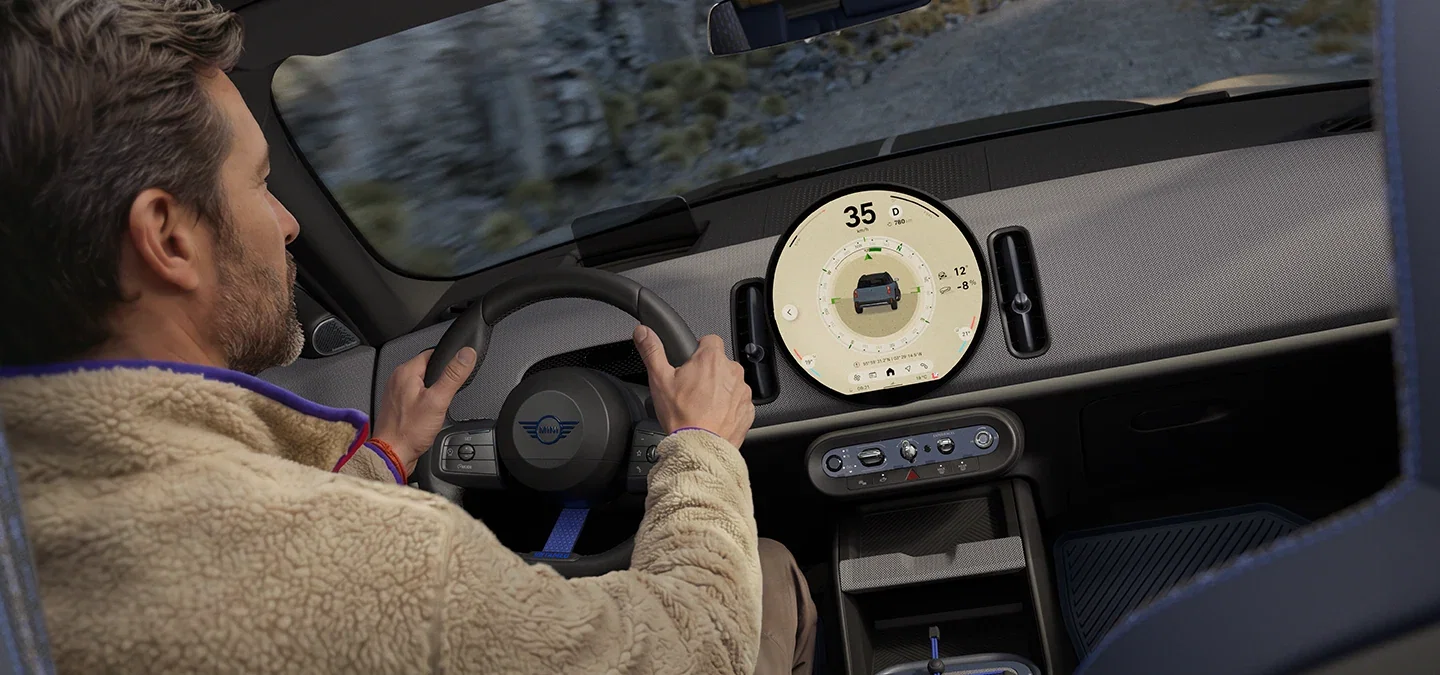 Driver and circular display inside the MINI Countryman.