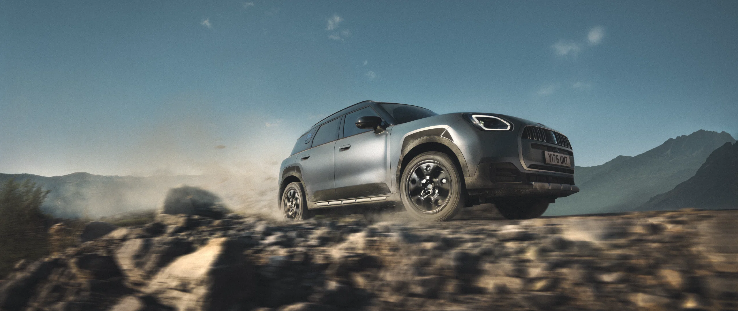 MINI Countryman Untamed Edition driving across rocky terrain.