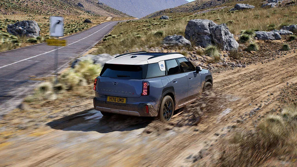 Rear view of the MINI Countryman Untamed Edition on a gravel road.