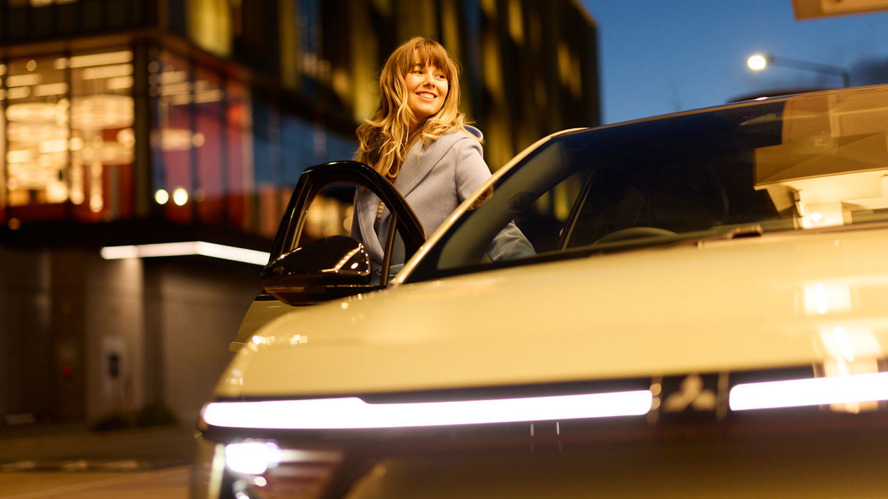 Woman standing beside an ASX VR-e