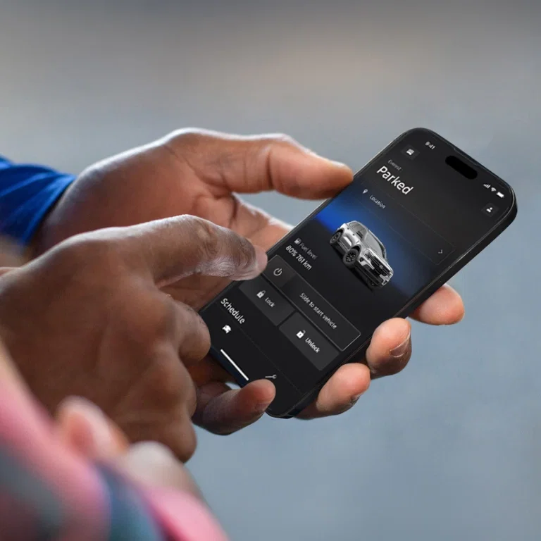 Hand using the FordPass app on a smartphone