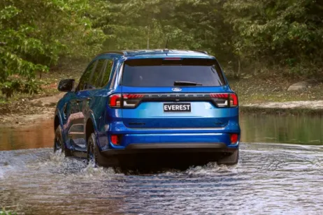 Ford Everest rear view at dusk near water