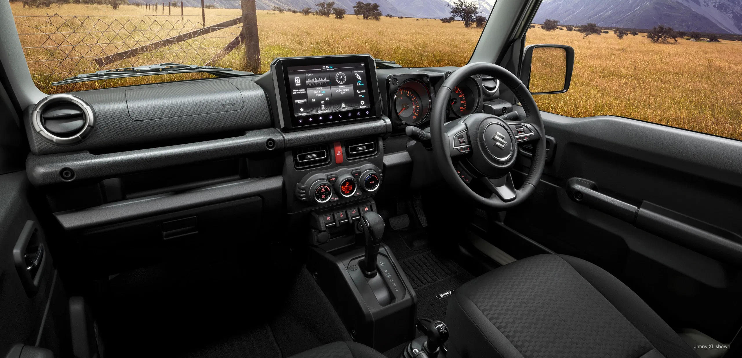 Suzuki Jimny interior showing dashboard and steering wheel