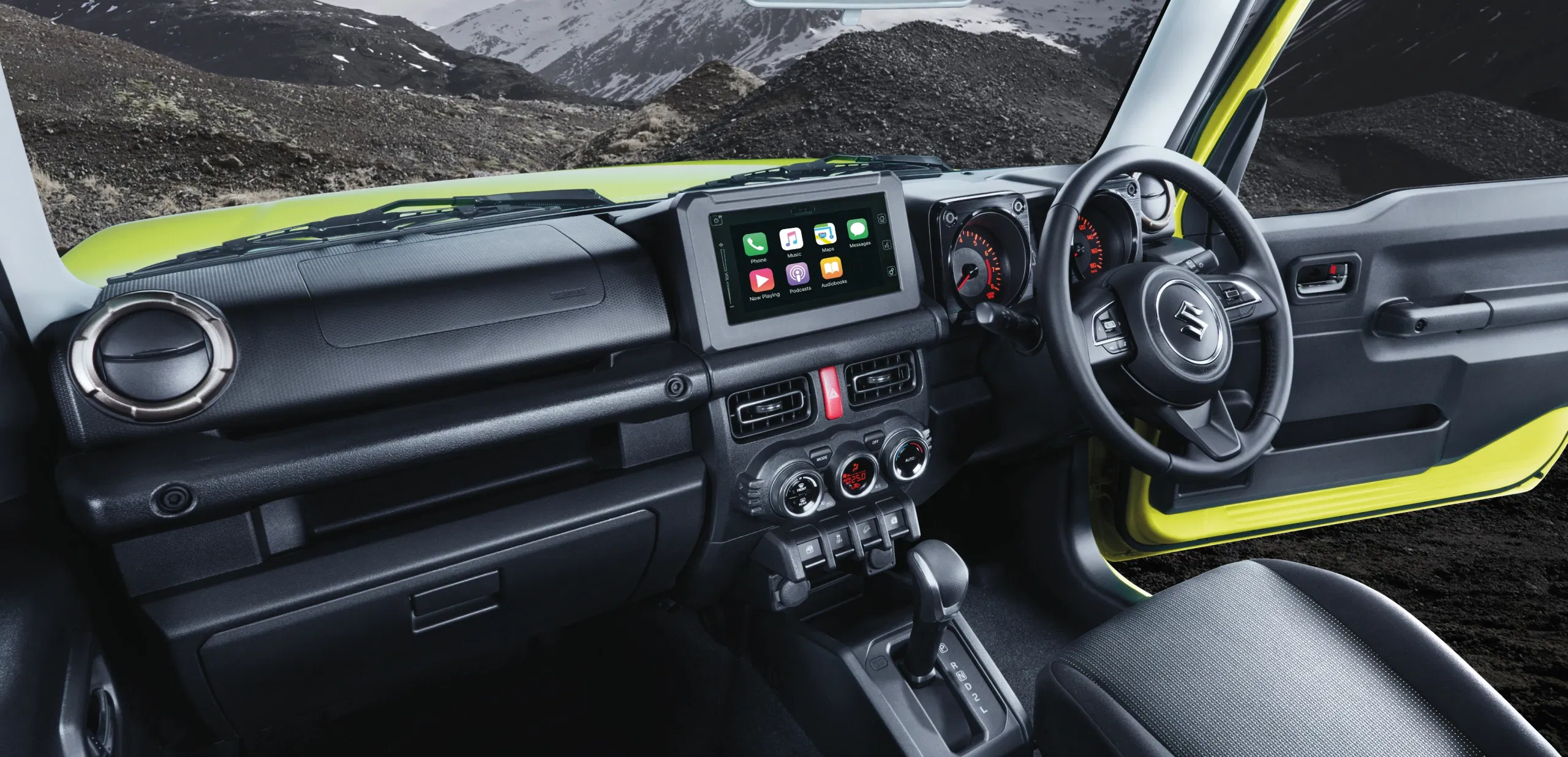 Suzuki Jimny navigating a rugged mountain path