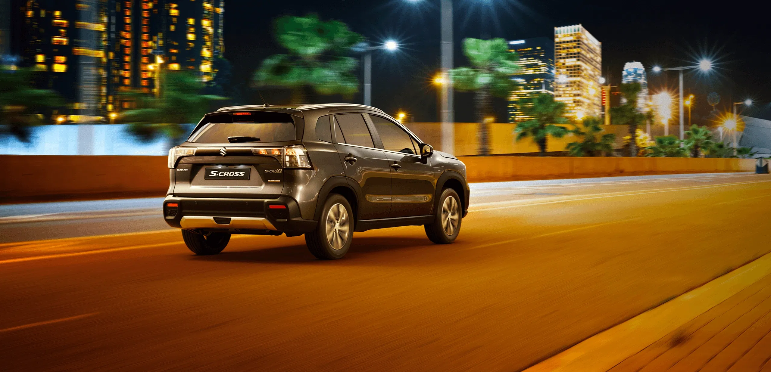 S-Cross SUV at night with city lights in the background