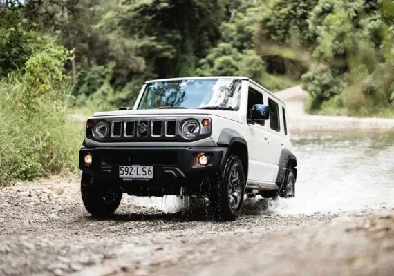 Suzuki Jimny XL AllGrip Pro 4x4 traction driving through rugged terrain