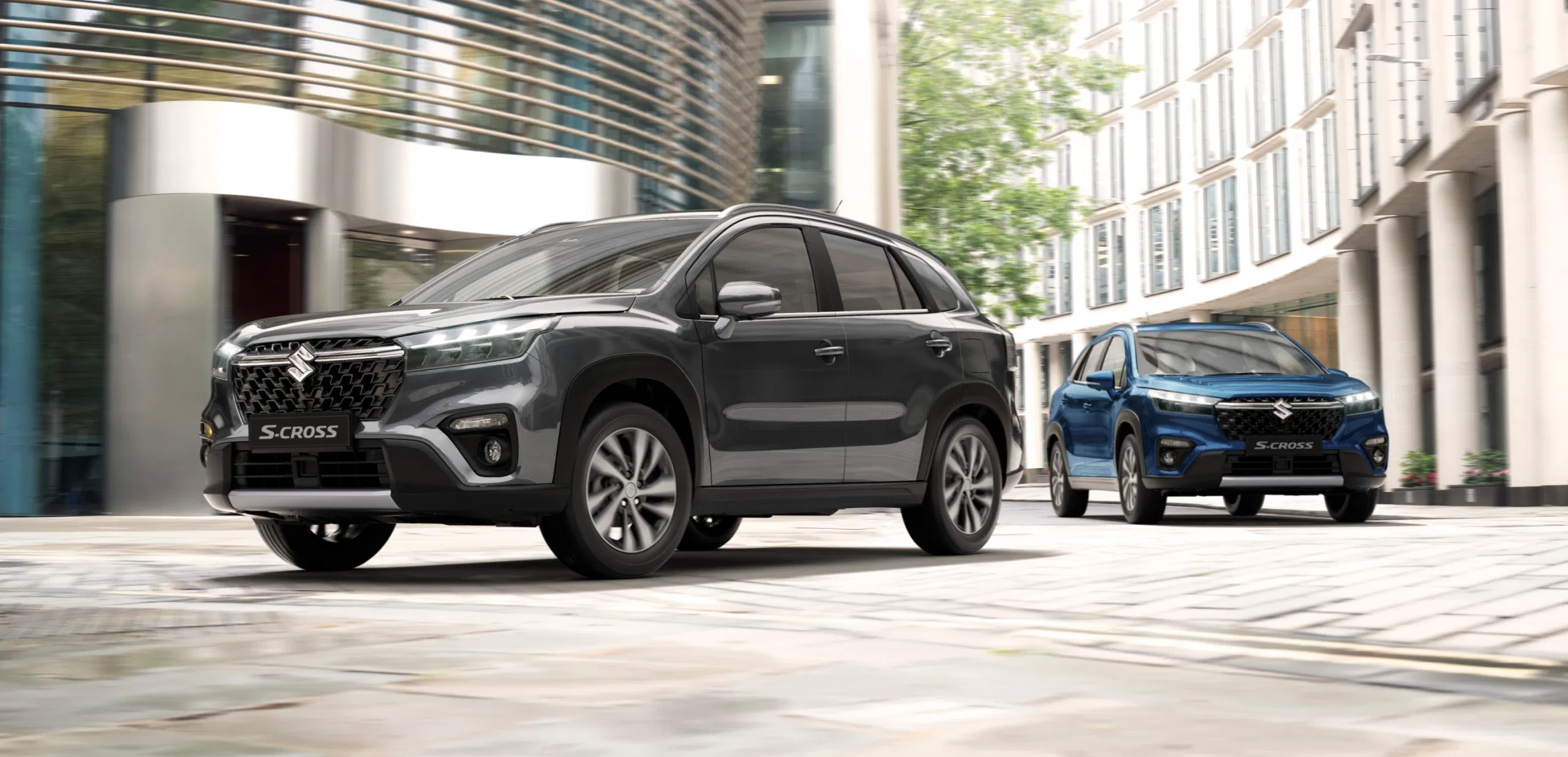 S-Cross SUV driving through a modern cityscape