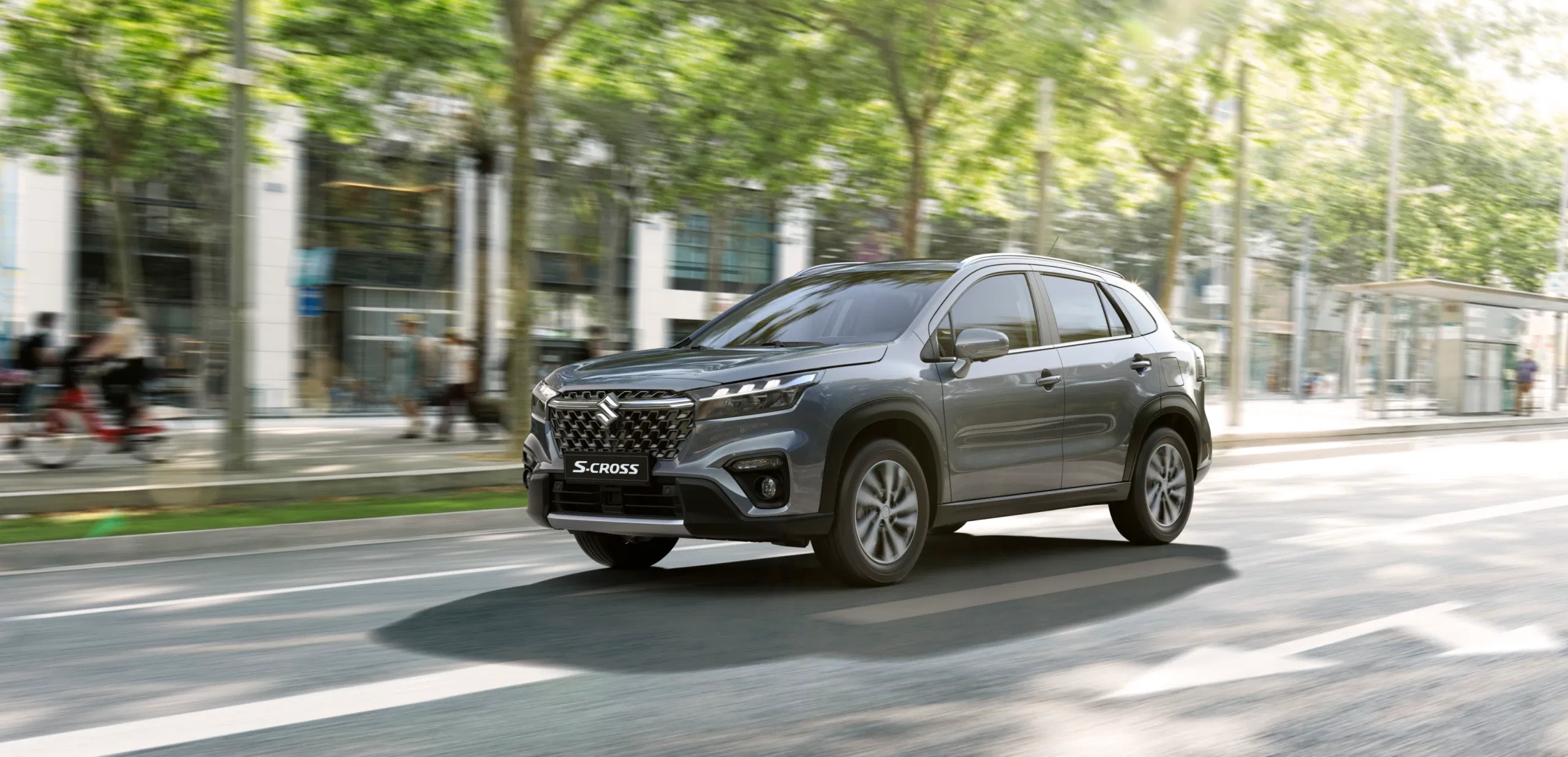 S-Cross SUV navigating through city traffic during the day