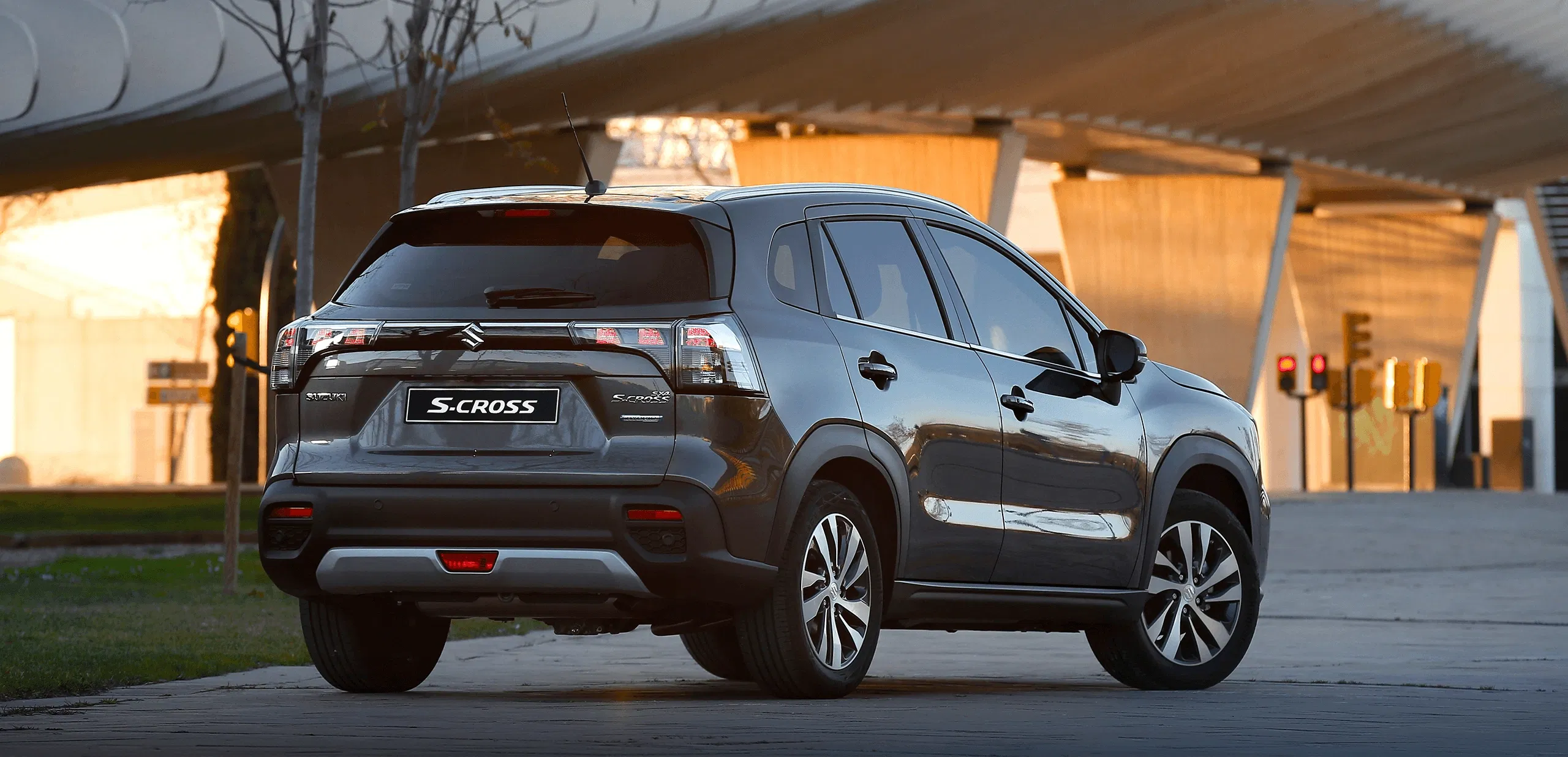 S-Cross SUV driving on a road at dusk