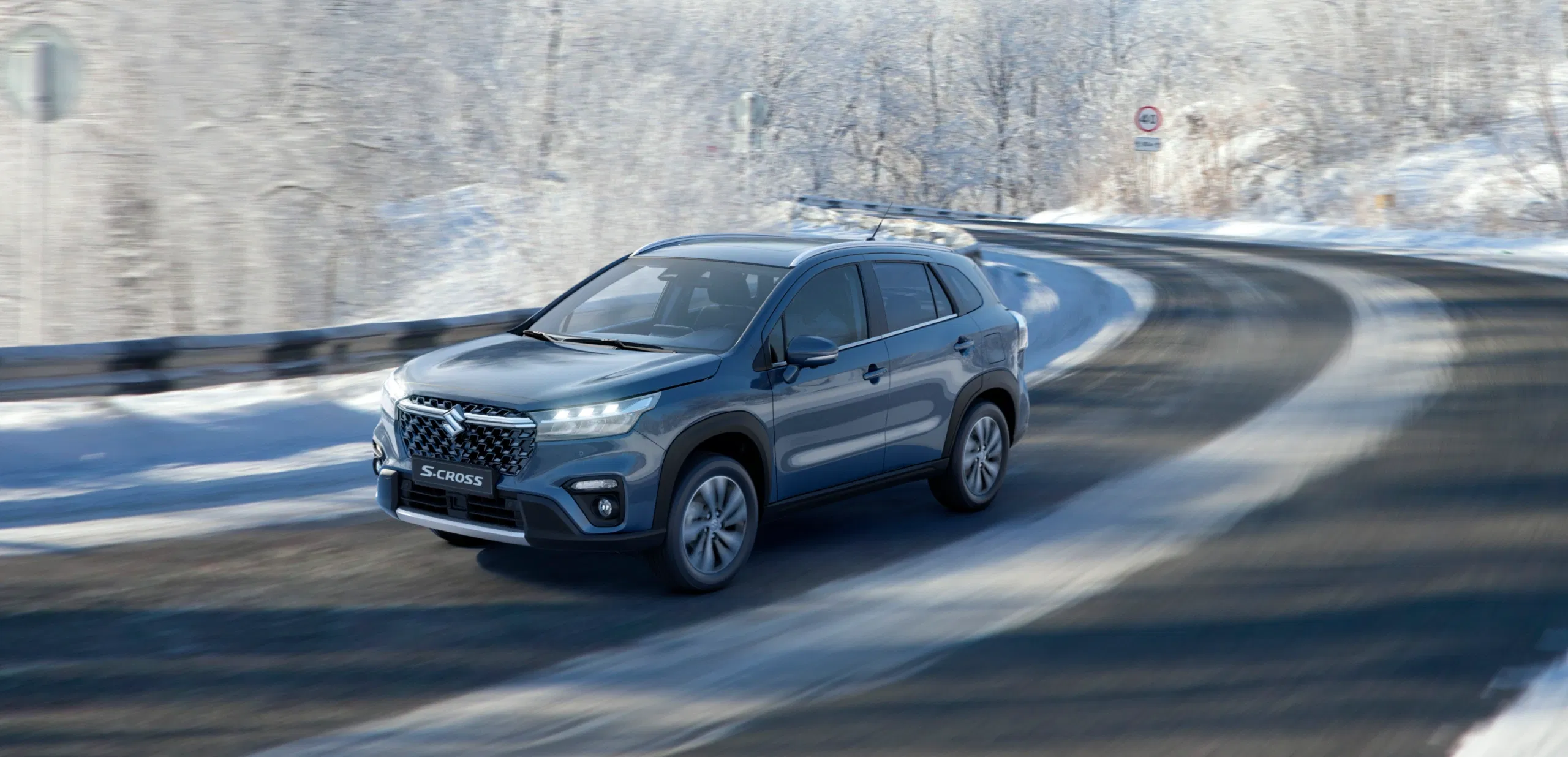 S-Cross SUV driving on a snowy road